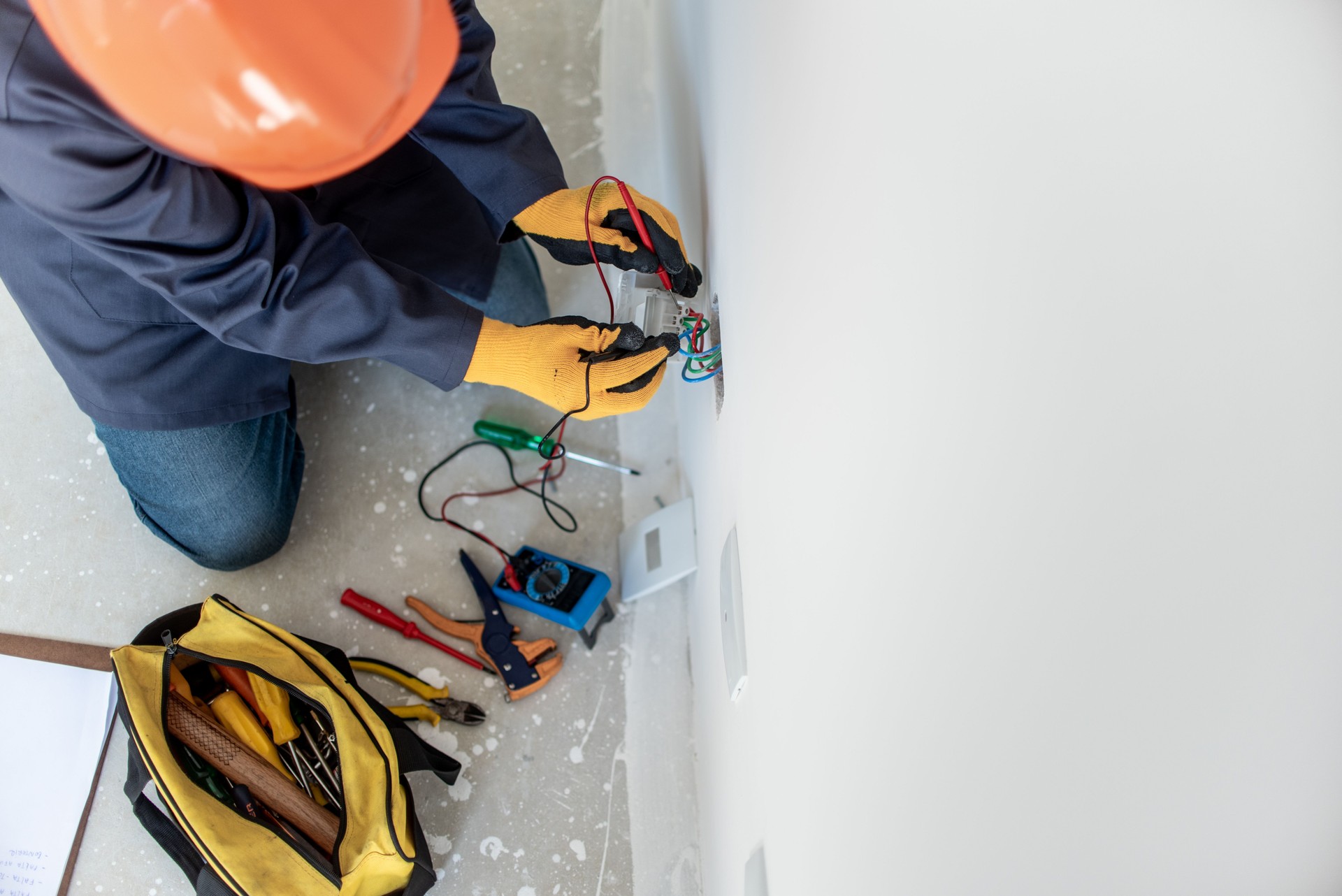 Man testing electricity with multimeter